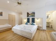 room with 4 beds with shower, WC